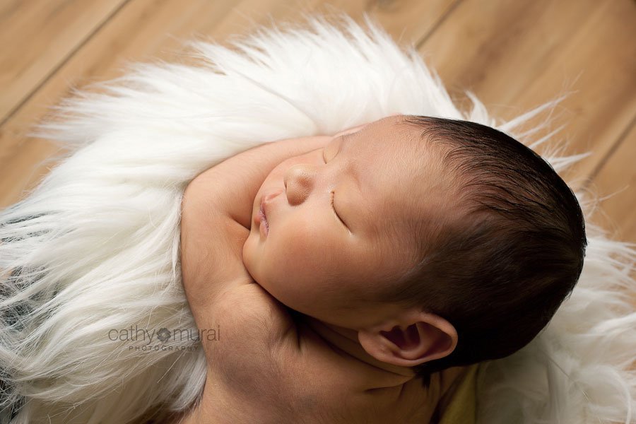 Baby Boy sleeping on the white fur
