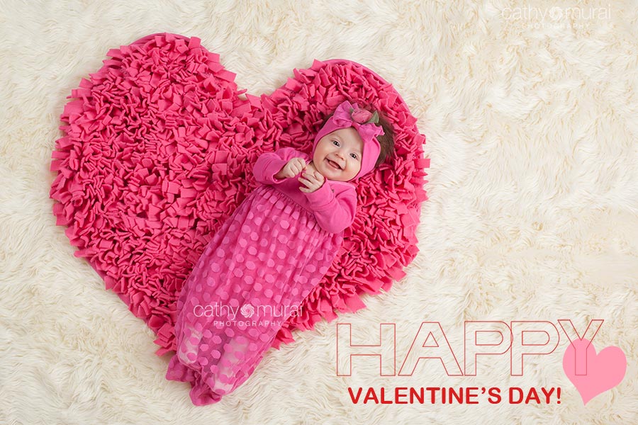 Happy Valentine's Day cards with an image of a baby girl smiling while laying on the heart shaped pink carpet taken at her 3 months old portrait session