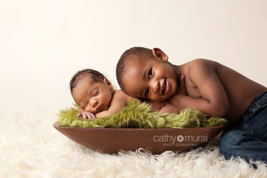 Brotherly love, siblings portrait, sibling shot  - African American baby boy sleeping and posing with his older brother - taken by  Alhambra Newborn and Baby photographer, Cathy Murai Photography, Los Angeles Newborn and Baby Photographer