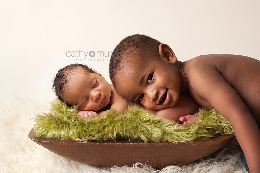 Brotherly love, siblings portrait, sibling shot  - African American baby boy sleeping and posing with his older brother - taken by  Alhambra Newborn and Baby photographer, Cathy Murai Photography, Los Angeles Newborn and Baby Photographer