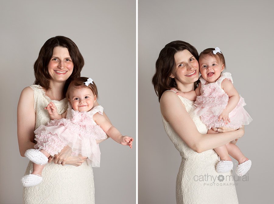 7months old happy baby in beautiful light pink dress smiling with her mom for their mother and daughter's shots during mother's day portrait session taken by Alhambra Baby Photographer, Cathy Murai Photography