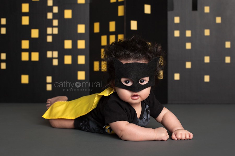Baby Batman flying in front of the building at night to save the world, Superhero baby photography, 100 days old celebration, Asian Baby with a Batman costume, 3 months old baby portraits,  3 months old baby picture, 100 day old,  baby boy,  3 months old baby image, Cathy Murai Photography, Alhambra, Baby, Photographer, Photography, San Gabriel Valley, Los Angeles, Batman costume