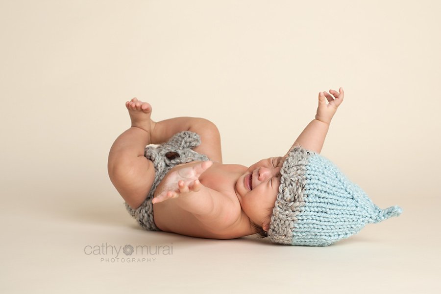 100 days old celebration, Asian Baby, 3 months old baby portraits,  3 months old baby picture, 100 day old,  baby boy,  3 months old baby image, crying, Cathy Murai Photography, Alhambra, Baby, Photographer, Photography, San Gabriel Valley, Los Angeles,  a baby wearing a blue and grey knit hat and grey diaper cover during a  Baby Photography Session 