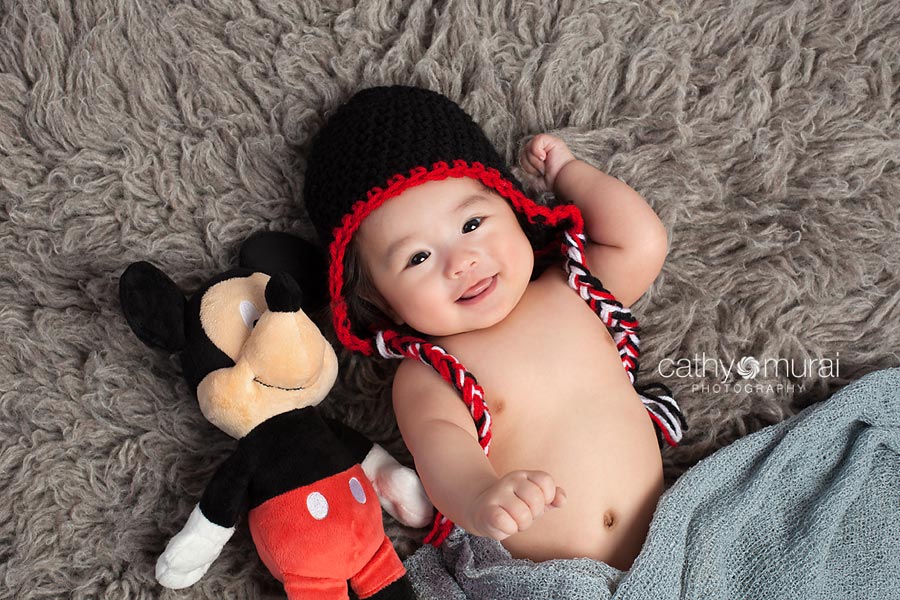 100 days old celebration, Asian Baby smiling next to his favorite Mickey mouse stuffed animal, 3 months old baby portraits,  3 months old baby picture, 100 day old,  baby boy,  3 months old baby image, Cathy Murai Photography, Alhambra, Baby, Photographer, Photography, San Gabriel Valley, Los Angeles,  a baby smiling during a  Baby Portrait Session 