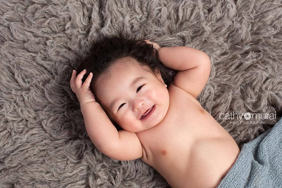 A cute Asian baby boy  smiling and laughing during his 100 days old portrait session, 100 days celebration, 3 months old baby portraits,  3 months old baby picture, 100 day old,  baby boy,  3 months old baby image, Cathy Murai Photography, Alhambra, Baby, Photographer, Photography, San Gabriel Valley, Los Angeles,  a baby smiling during a  Baby Portrait Session