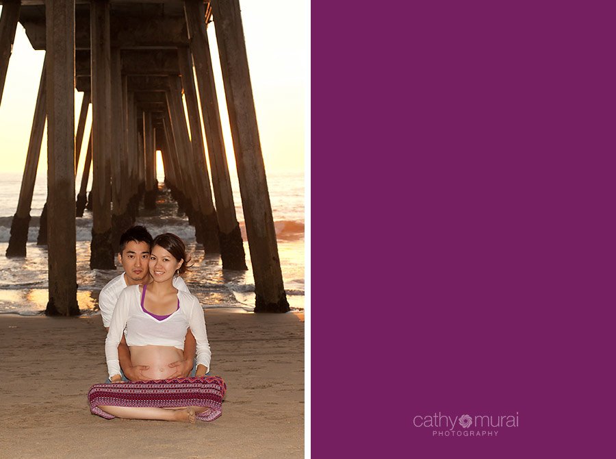 Daddy-to-be is hugging and holding a gorgeous mommy-to-be in front of the beach at Manhattan Beach during maternity portrait session, mama-to-be, parents-to-be, burgundy maternity skirt, Los Angeles Maternity photographer, Manhattan Beach Session, Beach  Maternity Portrait Session, Maternity Session at Beach, Cathy Murai Photography