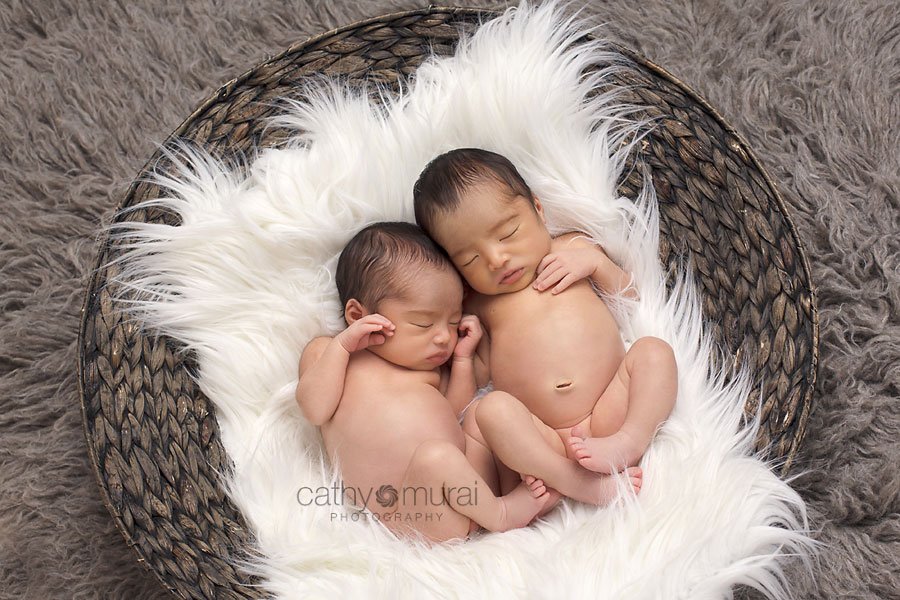 Newborn baby girl, twins, twin sisters, posing while sleeping in the round basket,  picture, image, portrait - captured by Los Angeles Newborn Photographer, Cathy Murai Photography