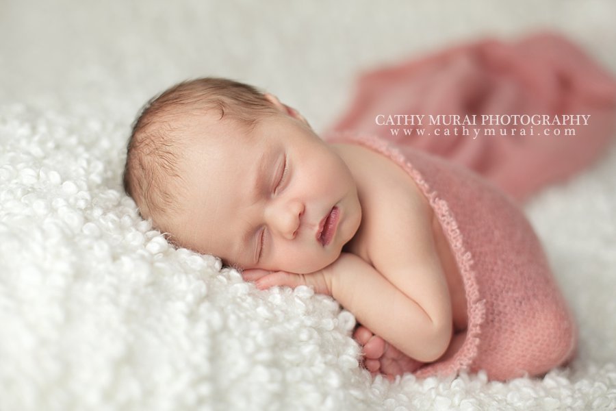 Precious Newborn Baby Girl wearing a pink wrap, the best taco pose Los Angeles. Pasadena, Newborn photographer, Cathy Miurai Photography 