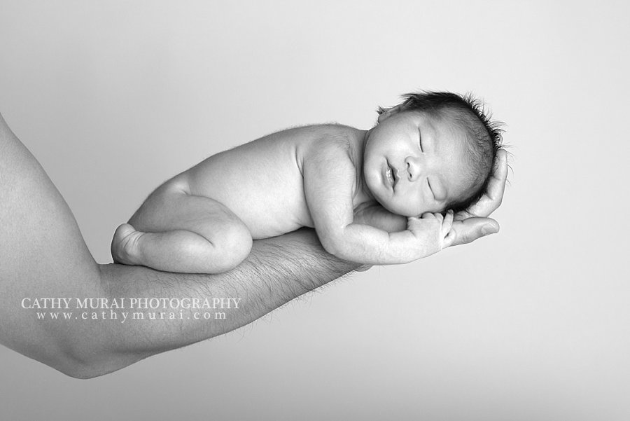 Father and newborn, father and daughter, father's arm, father's hand, black and white, newborn baby on father's arm, Family Portrait, family picture, family image, family with newborn, family and newborn, family of three, importance of family portraits, newborn session, newborn photography, newborn photographer, Cathy Murai Photography, San Gabriel Valley, Alhambra, Los Angeles