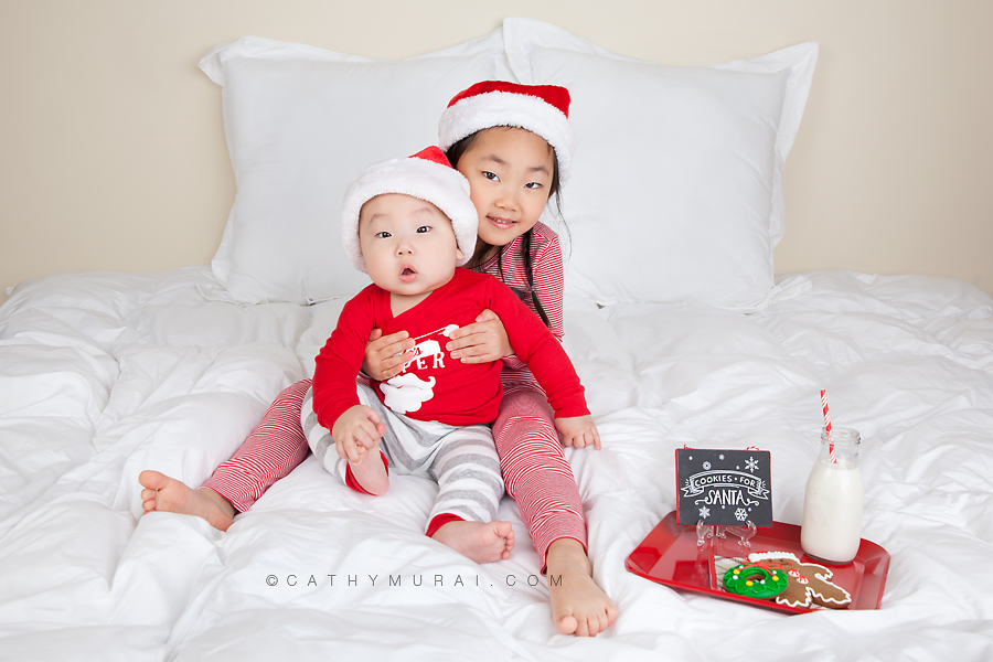 A beautiful girl and a handsome boy wearing Christmas pajamas while waiting for santa clause with cookies and milk, Cathy-Murai-Photography- Alhambra-South Pasadena-Pasadena-San Marino-San Gabriel Valley-Los Angeles-studio photography-Professional Christmas Photographer-Professional Christmas Photography-Christmas children  photography-Christmas siblings pictures-Christmas photography props-Christmas baby photography ideas- kids Christmas portraits- children Christmas photography- kids Christmas Photography