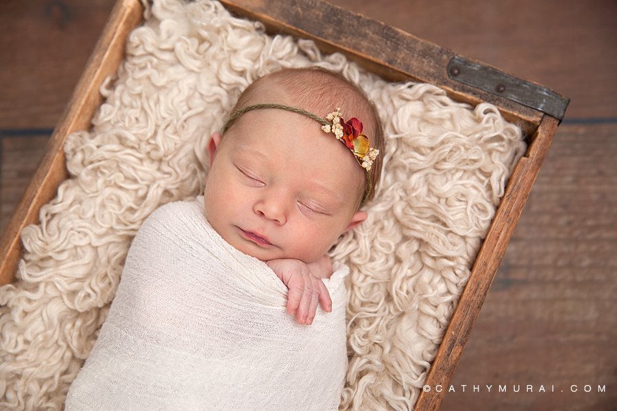 Newborn baby  girl wrapped by cream, white, ivory stretchy wrap, sleeping in the wooden vintage soda box on the wooden floor, Cathy Murai Photography, Los Angeles, Alhambra, South Pasadena, Pasadena, San Gabriel, San Marino Newborn Photographer