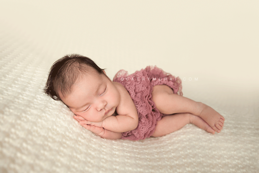 Newborn Baby Girl wearing dusty pink lace romper posing, Los Angeles Newborn Photographer, Cathy Murai Photography, Alhambra, Las Tunas, San Gabriel Valley