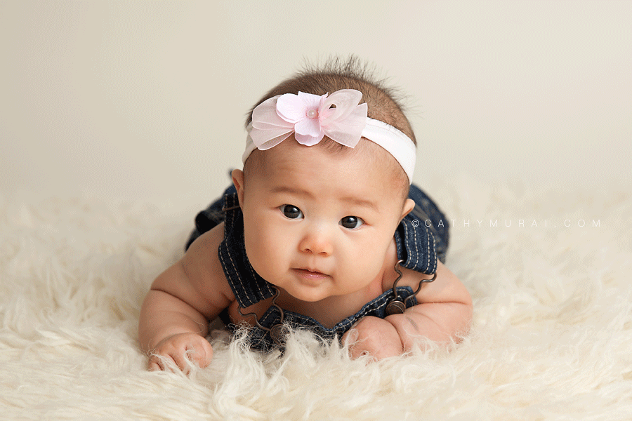 3 month old baby studio session, 3 month old Baby Sessions, 3 months old baby girl wearing pink headband and denim overall, tummy time
