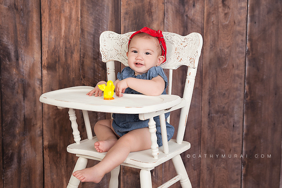 Alhambra San Gabriel San Marino Pasadena first Birthday Photographer Baby photographer Cute girl wearing denim cloth and red bandana for her first birthday portrait on white vintage high chair