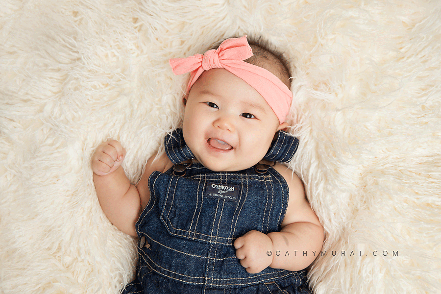 3 month old baby studio session, 3 month old Baby Session, 3 months old baby girl wearing pink headband and denim overall, smiling