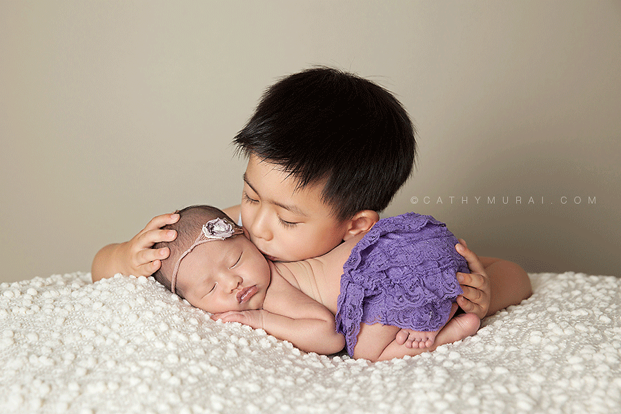 Newborn baby girl wearing cream headband and purple lace romper sleeping and posing on the white blanket with her older brother, sibling newborn photography, older brother kissing newborn sister, best newborn photographer,Los Angeles newborn baby photographer,Los Angeles newborn baby photography,famous baby photographer,famous newborn photographer,los angeles newborn photographer,los angeles newborn photography,los angeles newborn photographer,los angeles newborn photography,los angeles twin newborn photographer,los angeles twin newborn photography,newborn photo shoot los angeles,newborn photographer los angeles,newborn photographer alhambra,newborn photography los angeles, premier newborn photographer, Pasadena newborn baby photographer,Pasadena newborn photographer,San Gabriel Valley newborn photography,San Gabriel Valley newborn photographer,Alhambra newborn photography,top newborn photographer, Las Tunas newborn photography,Las Tunas newborn photographer