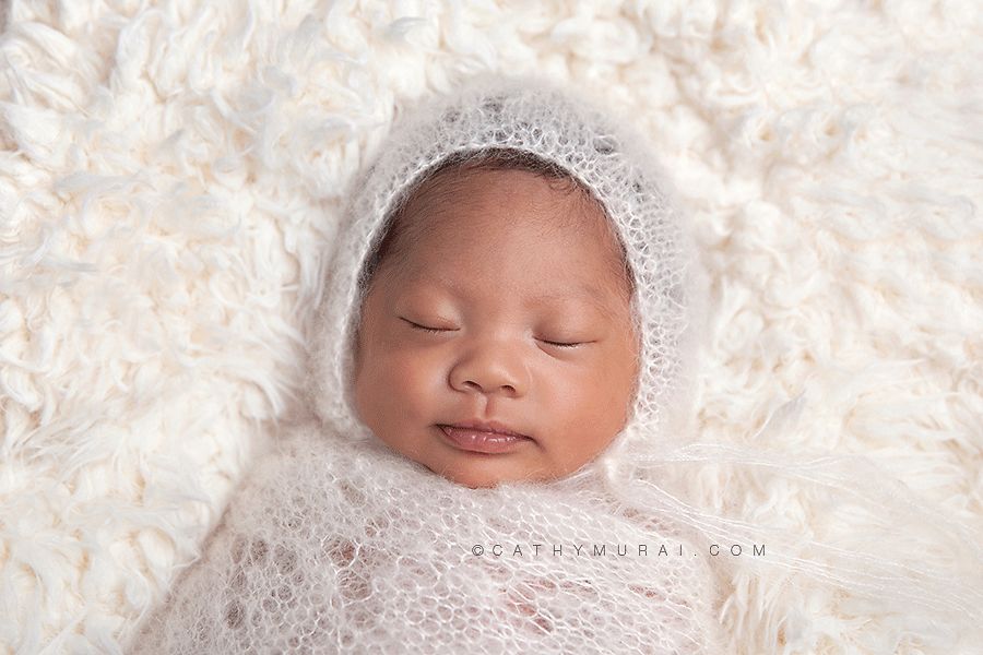 preemie newborn baby photography, preemie newborn baby picture, preemie newborn baby image, preemie newborn baby portrait, preemie newborn baby at 5 weeks old, wearing white knit hat and wrap, sleeping on white fur prop, captured by los angeles newborn baby photographer, los angeles  preemie photographer, los angeles newborn photographer, alhambar newborn baby photographer, lalhambra  preemie photographer, alhambra newborn photographer,  studio newborn photographer, Cathy Murai Photography