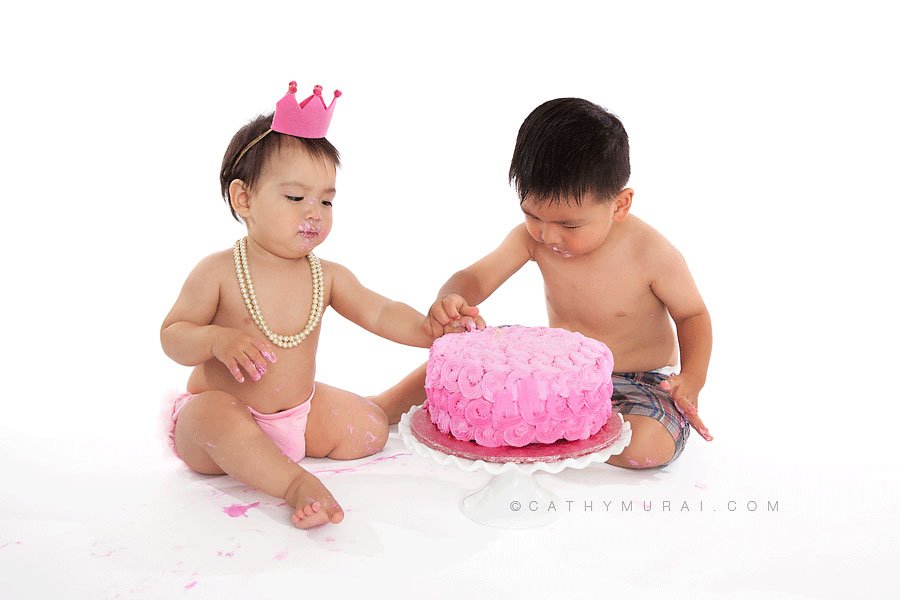 older brother helping the first birthday sister smashin gher birthday cake, pink crown and pink diaper cover, pearl necklace, LOS ANGELES Birthday Portraits, LOS ANGELES 1st Birthday Portraits, LOS ANGELES first Birthday pictures, LOS ANGELES Birthday Photographer, LOS ANGELES Birthday Photography, LOS ANGELES first Birthday Photography, LOS ANGELES first Birthday Photographer, LOS ANGELES 1st Birthday Photographer, , LOS ANGELES 1st Birthday Photography, LOS ANGELES Baby Photographer, LOS ANGELES Baby Photography, LOS ANGELES Family Photographer, LOS ANGELES Family Photography, Los Angeles Smash Cake, Los Angles Cake Smash, LA Birthday Portaits, LA 1st Birthday Portarits, LA first Birthday pictures, LA Birthday Photographer, LA Birthday Photography, LA first Birthday Photographer, LA first Birthday Photography, LA Baby Photographer, LA Baby Photography, LA Family Photographer, LA Family Photography, LA Smash Cake, LA Cake Smash, PASADENA Birthday Portraits, PASADENA 1st Birthday Portraits, PASADENA first Birthday pictures, PASADENA Birthday Photographer, PASADENA Birthday Photography, PASADENA first Birthday Photography, PASADENA first Birthday Photographer, PASADENA 1st Birthday Photographer, , PASADENA 1st Birthday Photography, PASADENA Baby Photographer, PASADENA Baby Photography, PASADENA Family Photographer, PASADENA Family Photography, Pasadena Smash Cake, Los Angles Cake Smash, SAN GABIEL VALLEY Birthday Portraits, SAN GABIEL VALLEY 1st Birthday Portraits, SAN GABIEL VALLEY first Birthday pictures, SAN GABIEL VALLEY Birthday Photographer, SAN GABIEL VALLEY Birthday Photography, SAN GABIEL VALLEY first Birthday Photography, SAN GABIEL VALLEY first Birthday Photographer, SAN GABIEL VALLEY 1st Birthday Photographer, , SAN GABIEL VALLEY 1st Birthday Photography, SAN GABIEL VALLEY Baby Photographer, SAN GABIEL VALLEY Baby Photography, SAN GABIEL VALLEY Family Photographer, SAN GABIEL VALLEY Family Photography, San Gabiel Valley Smash Cake, Los Angles Cake Smash, ALHAMBRA Birthday Portraits, ALHAMBRA 1st Birthday Portraits, ALHAMBRA first Birthday pictures, ALHAMBRA Birthday Photographer, ALHAMBRA Birthday Photography, ALHAMBRA first Birthday Photography, ALHAMBRA first Birthday Photographer, ALHAMBRA 1st Birthday Photographer, , ALHAMBRA 1st Birthday Photography, ALHAMBRA Baby Photographer, ALHAMBRA Baby Photography, ALHAMBRA Family Photographer, ALHAMBRA Family Photography, Alhambra Smash Cake, Los Angles Cake Smash, SAN MARINOBirthday Portraits, SAN MARINO1st Birthday Portraits, SAN MARINOfirst Birthday pictures, SAN MARINOBirthday Photographer, SAN MARINOBirthday Photography, SAN MARINOfirst Birthday Photography, SAN MARINOfirst Birthday Photographer, SAN MARINO1st Birthday Photographer, , SAN MARINO1st Birthday Photography, SAN MARINOBaby Photographer, SAN MARINOBaby Photography, SAN MARINOFamily Photographer, SAN MARINOFamily Photography, San MarinoSmash Cake, Los Angles Cake Smash, TEMPLE CITYBirthday Portraits, TEMPLE CITY1st Birthday Portraits, TEMPLE CITYfirst Birthday pictures, TEMPLE CITYBirthday Photographer, TEMPLE CITYBirthday Photography, TEMPLE CITYfirst Birthday Photography, TEMPLE CITYfirst Birthday Photographer, TEMPLE CITY1st Birthday Photographer, , TEMPLE CITY1st Birthday Photography, TEMPLE CITYBaby Photographer, TEMPLE CITYBaby Photography, TEMPLE CITYFamily Photographer, TEMPLE CITYFamily Photography, Temple CitySmash Cake, Los Angles Cake Smash, ROSEMEADBirthday Portraits, ROSEMEAD1st Birthday Portraits, ROSEMEADfirst Birthday pictures, ROSEMEADBirthday Photographer, ROSEMEADBirthday Photography, ROSEMEADfirst Birthday Photography, ROSEMEADfirst Birthday Photographer, ROSEMEAD1st Birthday Photographer, , ROSEMEAD1st Birthday Photography, ROSEMEADBaby Photographer, ROSEMEADBaby Photography, ROSEMEADFamily Photographer, ROSEMEADFamily Photography, RosemeadSmash Cake, Los Angles Cake Smash, DOWNTOWN LOS ANGELES Birthday Portraits, DOWNTOWN LOS ANGELES 1st Birthday Portraits, DOWNTOWN LOS ANGELES first Birthday pictures, DOWNTOWN LOS ANGELES Birthday Photographer, DOWNTOWN LOS ANGELES Birthday Photography, DOWNTOWN LOS ANGELES first Birthday Photography, DOWNTOWN LOS ANGELES first Birthday Photographer, DOWNTOWN LOS ANGELES 1st Birthday Photographer, , DOWNTOWN LOS ANGELES 1st Birthday Photography, DOWNTOWN LOS ANGELES Baby Photographer, DOWNTOWN LOS ANGELES Baby Photography, DOWNTOWN LOS ANGELES Family Photographer, DOWNTOWN LOS ANGELES Family Photography, Downtown Los Angeles Smash Cake, Los Angles Cake Smash