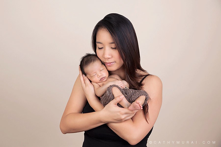 New mother holding and kissing her newborn baby boy, mother and newborn portriat, mother and newborn photogrpahy, mother and newborn picutre, mother and newborn image, Los Angeles Newborn Photographer, Alhambra newborn photographer, newborn picture, newborn image, newborn portrait, newborn studio photography, newborn photography, Cathy Murai Photography