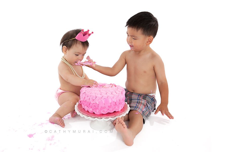 older brother helping the first birthday sister smashin gher birthday cake, pink crown and pink diaper cover, pearl necklace, LOS ANGELES Birthday Portraits, LOS ANGELES 1st Birthday Portraits, LOS ANGELES first Birthday pictures, LOS ANGELES Birthday Photographer, LOS ANGELES Birthday Photography, LOS ANGELES first Birthday Photography, LOS ANGELES first Birthday Photographer, LOS ANGELES 1st Birthday Photographer, , LOS ANGELES 1st Birthday Photography, LOS ANGELES Baby Photographer, LOS ANGELES Baby Photography, LOS ANGELES Family Photographer, LOS ANGELES Family Photography, Los Angeles Smash Cake, Los Angles Cake Smash, LA Birthday Portaits, LA 1st Birthday Portarits, LA first Birthday pictures, LA Birthday Photographer, LA Birthday Photography, LA first Birthday Photographer, LA first Birthday Photography, LA Baby Photographer, LA Baby Photography, LA Family Photographer, LA Family Photography, LA Smash Cake, LA Cake Smash, PASADENA Birthday Portraits, PASADENA 1st Birthday Portraits, PASADENA first Birthday pictures, PASADENA Birthday Photographer, PASADENA Birthday Photography, PASADENA first Birthday Photography, PASADENA first Birthday Photographer, PASADENA 1st Birthday Photographer, , PASADENA 1st Birthday Photography, PASADENA Baby Photographer, PASADENA Baby Photography, PASADENA Family Photographer, PASADENA Family Photography, Pasadena Smash Cake, Los Angles Cake Smash, SAN GABIEL VALLEY Birthday Portraits, SAN GABIEL VALLEY 1st Birthday Portraits, SAN GABIEL VALLEY first Birthday pictures, SAN GABIEL VALLEY Birthday Photographer, SAN GABIEL VALLEY Birthday Photography, SAN GABIEL VALLEY first Birthday Photography, SAN GABIEL VALLEY first Birthday Photographer, SAN GABIEL VALLEY 1st Birthday Photographer, , SAN GABIEL VALLEY 1st Birthday Photography, SAN GABIEL VALLEY Baby Photographer, SAN GABIEL VALLEY Baby Photography, SAN GABIEL VALLEY Family Photographer, SAN GABIEL VALLEY Family Photography, San Gabiel Valley Smash Cake, Los Angles Cake Smash, ALHAMBRA Birthday Portraits, ALHAMBRA 1st Birthday Portraits, ALHAMBRA first Birthday pictures, ALHAMBRA Birthday Photographer, ALHAMBRA Birthday Photography, ALHAMBRA first Birthday Photography, ALHAMBRA first Birthday Photographer, ALHAMBRA 1st Birthday Photographer, , ALHAMBRA 1st Birthday Photography, ALHAMBRA Baby Photographer, ALHAMBRA Baby Photography, ALHAMBRA Family Photographer, ALHAMBRA Family Photography, Alhambra Smash Cake, Los Angles Cake Smash, SAN MARINOBirthday Portraits, SAN MARINO1st Birthday Portraits, SAN MARINOfirst Birthday pictures, SAN MARINOBirthday Photographer, SAN MARINOBirthday Photography, SAN MARINOfirst Birthday Photography, SAN MARINOfirst Birthday Photographer, SAN MARINO1st Birthday Photographer, , SAN MARINO1st Birthday Photography, SAN MARINOBaby Photographer, SAN MARINOBaby Photography, SAN MARINOFamily Photographer, SAN MARINOFamily Photography, San MarinoSmash Cake, Los Angles Cake Smash, TEMPLE CITYBirthday Portraits, TEMPLE CITY1st Birthday Portraits, TEMPLE CITYfirst Birthday pictures, TEMPLE CITYBirthday Photographer, TEMPLE CITYBirthday Photography, TEMPLE CITYfirst Birthday Photography, TEMPLE CITYfirst Birthday Photographer, TEMPLE CITY1st Birthday Photographer, , TEMPLE CITY1st Birthday Photography, TEMPLE CITYBaby Photographer, TEMPLE CITYBaby Photography, TEMPLE CITYFamily Photographer, TEMPLE CITYFamily Photography, Temple CitySmash Cake, Los Angles Cake Smash, ROSEMEADBirthday Portraits, ROSEMEAD1st Birthday Portraits, ROSEMEADfirst Birthday pictures, ROSEMEADBirthday Photographer, ROSEMEADBirthday Photography, ROSEMEADfirst Birthday Photography, ROSEMEADfirst Birthday Photographer, ROSEMEAD1st Birthday Photographer, , ROSEMEAD1st Birthday Photography, ROSEMEADBaby Photographer, ROSEMEADBaby Photography, ROSEMEADFamily Photographer, ROSEMEADFamily Photography, RosemeadSmash Cake, Los Angles Cake Smash, DOWNTOWN LOS ANGELES Birthday Portraits, DOWNTOWN LOS ANGELES 1st Birthday Portraits, DOWNTOWN LOS ANGELES first Birthday pictures, DOWNTOWN LOS ANGELES Birthday Photographer, DOWNTOWN LOS ANGELES Birthday Photography, DOWNTOWN LOS ANGELES first Birthday Photography, DOWNTOWN LOS ANGELES first Birthday Photographer, DOWNTOWN LOS ANGELES 1st Birthday Photographer, , DOWNTOWN LOS ANGELES 1st Birthday Photography, DOWNTOWN LOS ANGELES Baby Photographer, DOWNTOWN LOS ANGELES Baby Photography, DOWNTOWN LOS ANGELES Family Photographer, DOWNTOWN LOS ANGELES Family Photography, Downtown Los Angeles Smash Cake, Los Angles Cake Smash