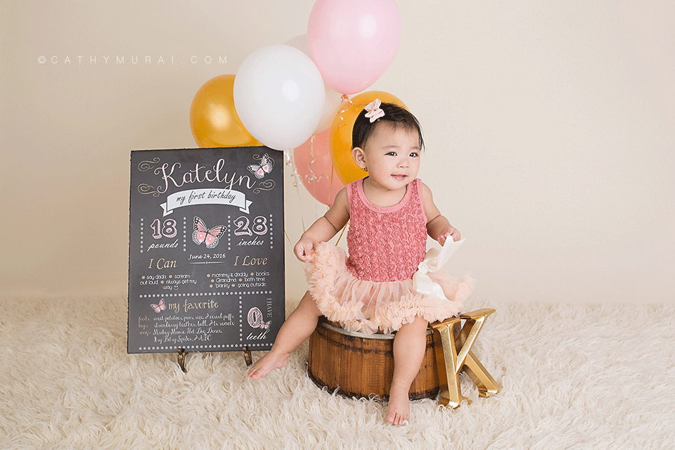 First Birthday Portraits, first birthday girl sitting next to the 1st birthday chalkboard, first birthday chalkboard photography prop, pink, white, gold balloons, LOS ANGELES Birthday Portraits, LOS ANGELES 1st Birthday Portraits, LOS ANGELES first Birthday Portraits, LOS ANGELES 1st Birthday pictures, LOS ANGELES first Birthday pictures, LOS ANGELES Birthday pictures, LOS ANGELES 1st Birthday Photography, LOS ANGELES first Birthday Photography, LOS ANGELES Birthday Photography, LOS ANGELES first Birthday Photographer, LOS ANGELES 1st Birthday Photographer, LOS ANGELES Birthday Photographer, LOS ANGELES Baby Photographer, LOS ANGELES Baby Photography, LOS ANGELES Baby Photographer, Los Angeles Smash Cake, Los Angles Cake Smash, LA Birthday Portaits, LA 1st Birthday Portarits, LA first Birthday pictures, LA Birthday Photographer, LA Birthday Photography, LA first Birthday Photographer, LA first Birthday Photography, LA Baby Photographer, LA Baby Photography, LA Family Photographer, LA Family Photography, LA Smash Cake, LA Cake Smash, PASADENA Birthday Portraits, PASADENA 1st Birthday Portraits, PASADENA first Birthday pictures, PASADENA Birthday Photographer, PASADENA Birthday Photography, PASADENA first Birthday Photography, PASADENA first Birthday Photographer, PASADENA 1st Birthday Photographer, , PASADENA 1st Birthday Photography, PASADENA Baby Photographer, PASADENA Baby Photography, PASADENA Family Photographer, PASADENA Family Photography, Pasadena Smash Cake, Los Angles Cake Smash, SAN GABIEL VALLEY Birthday Portraits, SAN GABIEL VALLEY 1st Birthday Portraits, SAN GABIEL VALLEY first Birthday pictures, SAN GABIEL VALLEY Birthday Photographer, SAN GABIEL VALLEY Birthday Photography, SAN GABIEL VALLEY first Birthday Photography, SAN GABIEL VALLEY first Birthday Photographer, SAN GABIEL VALLEY 1st Birthday Photographer, , SAN GABIEL VALLEY 1st Birthday Photography, SAN GABIEL VALLEY Baby Photographer, SAN GABIEL VALLEY Baby Photography, SAN GABIEL VALLEY Family Photographer, SAN GABIEL VALLEY Family Photography, San Gabiel Valley Smash Cake, Los Angles Cake Smash, ALHAMBRA Birthday Portraits, ALHAMBRA 1st Birthday Portraits, ALHAMBRA first Birthday pictures, ALHAMBRA Birthday Photographer, ALHAMBRA Birthday Photography, ALHAMBRA first Birthday Photography, ALHAMBRA first Birthday Photographer, ALHAMBRA 1st Birthday Photographer, , ALHAMBRA 1st Birthday Photography, ALHAMBRA Baby Photographer, ALHAMBRA Baby Photography, ALHAMBRA Family Photographer, ALHAMBRA Family Photography, Alhambra Smash Cake, Los Angles Cake Smash, SAN MARINOBirthday Portraits, SAN MARINO1st Birthday Portraits, SAN MARINOfirst Birthday pictures, SAN MARINOBirthday Photographer, SAN MARINOBirthday Photography, SAN MARINOfirst Birthday Photography, SAN MARINOfirst Birthday Photographer, SAN MARINO1st Birthday Photographer, , SAN MARINO1st Birthday Photography, SAN MARINOBaby Photographer, SAN MARINOBaby Photography, SAN MARINOFamily Photographer, SAN MARINOFamily Photography, San MarinoSmash Cake, Los Angles Cake Smash, TEMPLE CITYBirthday Portraits, TEMPLE CITY1st Birthday Portraits, TEMPLE CITYfirst Birthday pictures, TEMPLE CITYBirthday Photographer, TEMPLE CITYBirthday Photography, TEMPLE CITYfirst Birthday Photography, TEMPLE CITYfirst Birthday Photographer, TEMPLE CITY1st Birthday Photographer, , TEMPLE CITY1st Birthday Photography, TEMPLE CITYBaby Photographer, TEMPLE CITYBaby Photography, TEMPLE CITYFamily Photographer, TEMPLE CITYFamily Photography, Temple CitySmash Cake, Los Angles Cake Smash, ROSEMEADBirthday Portraits, ROSEMEAD1st Birthday Portraits, ROSEMEADfirst Birthday pictures, ROSEMEADBirthday Photographer, ROSEMEADBirthday Photography, ROSEMEADfirst Birthday Photography, ROSEMEADfirst Birthday Photographer, ROSEMEAD1st Birthday Photographer, , ROSEMEAD1st Birthday Photography, ROSEMEADBaby Photographer, ROSEMEADBaby Photography, ROSEMEADFamily Photographer, ROSEMEADFamily Photography, RosemeadSmash Cake, Los Angles Cake Smash, DOWNTOWN LOS ANGELES Birthday Portraits, DOWNTOWN LOS ANGELES 1st Birthday Portraits, DOWNTOWN LOS ANGELES first Birthday pictures, DOWNTOWN LOS ANGELES Birthday Photographer, DOWNTOWN LOS ANGELES Birthday Photography, DOWNTOWN LOS ANGELES first Birthday Photography, DOWNTOWN LOS ANGELES first Birthday Photographer, DOWNTOWN LOS ANGELES 1st Birthday Photographer, , DOWNTOWN LOS ANGELES 1st Birthday Photography, DOWNTOWN LOS ANGELES Baby Photographer, DOWNTOWN LOS ANGELES Baby Photography, DOWNTOWN LOS ANGELES Family Photographer, DOWNTOWN LOS ANGELES Family Photography, Downtown Los Angeles Smash Cake, Los Angles Cake Smash