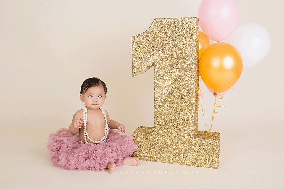 First Birthday Portraits, First birthday girl wearing pink pettiiskirt next to gold giant glitter #1 prop, 1st birthday prop, LOS ANGELES Birthday Portraits, LOS ANGELES 1st Birthday Portraits, LOS ANGELES first Birthday Portraits, LOS ANGELES 1st Birthday pictures, LOS ANGELES first Birthday pictures, LOS ANGELES Birthday pictures, LOS ANGELES 1st Birthday Photography, LOS ANGELES first Birthday Photography, LOS ANGELES Birthday Photography, LOS ANGELES first Birthday Photographer, LOS ANGELES 1st Birthday Photographer, LOS ANGELES Birthday Photographer, LOS ANGELES Baby Photographer, LOS ANGELES Baby Photography, LOS ANGELES Baby Photographer, Los Angeles Smash Cake, Los Angles Cake Smash, LA Birthday Portaits, LA 1st Birthday Portarits, LA first Birthday pictures, LA Birthday Photographer, LA Birthday Photography, LA first Birthday Photographer, LA first Birthday Photography, LA Baby Photographer, LA Baby Photography, LA Family Photographer, LA Family Photography, LA Smash Cake, LA Cake Smash, PASADENA Birthday Portraits, PASADENA 1st Birthday Portraits, PASADENA first Birthday pictures, PASADENA Birthday Photographer, PASADENA Birthday Photography, PASADENA first Birthday Photography, PASADENA first Birthday Photographer, PASADENA 1st Birthday Photographer, , PASADENA 1st Birthday Photography, PASADENA Baby Photographer, PASADENA Baby Photography, PASADENA Family Photographer, PASADENA Family Photography, Pasadena Smash Cake, Los Angles Cake Smash, SAN GABIEL VALLEY Birthday Portraits, SAN GABIEL VALLEY 1st Birthday Portraits, SAN GABIEL VALLEY first Birthday pictures, SAN GABIEL VALLEY Birthday Photographer, SAN GABIEL VALLEY Birthday Photography, SAN GABIEL VALLEY first Birthday Photography, SAN GABIEL VALLEY first Birthday Photographer, SAN GABIEL VALLEY 1st Birthday Photographer, , SAN GABIEL VALLEY 1st Birthday Photography, SAN GABIEL VALLEY Baby Photographer, SAN GABIEL VALLEY Baby Photography, SAN GABIEL VALLEY Family Photographer, SAN GABIEL VALLEY Family Photography, San Gabiel Valley Smash Cake, Los Angles Cake Smash, ALHAMBRA Birthday Portraits, ALHAMBRA 1st Birthday Portraits, ALHAMBRA first Birthday pictures, ALHAMBRA Birthday Photographer, ALHAMBRA Birthday Photography, ALHAMBRA first Birthday Photography, ALHAMBRA first Birthday Photographer, ALHAMBRA 1st Birthday Photographer, , ALHAMBRA 1st Birthday Photography, ALHAMBRA Baby Photographer, ALHAMBRA Baby Photography, ALHAMBRA Family Photographer, ALHAMBRA Family Photography, Alhambra Smash Cake, Los Angles Cake Smash, SAN MARINOBirthday Portraits, SAN MARINO1st Birthday Portraits, SAN MARINOfirst Birthday pictures, SAN MARINOBirthday Photographer, SAN MARINOBirthday Photography, SAN MARINOfirst Birthday Photography, SAN MARINOfirst Birthday Photographer, SAN MARINO1st Birthday Photographer, , SAN MARINO1st Birthday Photography, SAN MARINOBaby Photographer, SAN MARINOBaby Photography, SAN MARINOFamily Photographer, SAN MARINOFamily Photography, San MarinoSmash Cake, Los Angles Cake Smash, TEMPLE CITYBirthday Portraits, TEMPLE CITY1st Birthday Portraits, TEMPLE CITYfirst Birthday pictures, TEMPLE CITYBirthday Photographer, TEMPLE CITYBirthday Photography, TEMPLE CITYfirst Birthday Photography, TEMPLE CITYfirst Birthday Photographer, TEMPLE CITY1st Birthday Photographer, , TEMPLE CITY1st Birthday Photography, TEMPLE CITYBaby Photographer, TEMPLE CITYBaby Photography, TEMPLE CITYFamily Photographer, TEMPLE CITYFamily Photography, Temple CitySmash Cake, Los Angles Cake Smash, ROSEMEADBirthday Portraits, ROSEMEAD1st Birthday Portraits, ROSEMEADfirst Birthday pictures, ROSEMEADBirthday Photographer, ROSEMEADBirthday Photography, ROSEMEADfirst Birthday Photography, ROSEMEADfirst Birthday Photographer, ROSEMEAD1st Birthday Photographer, , ROSEMEAD1st Birthday Photography, ROSEMEADBaby Photographer, ROSEMEADBaby Photography, ROSEMEADFamily Photographer, ROSEMEADFamily Photography, RosemeadSmash Cake, Los Angles Cake Smash, DOWNTOWN LOS ANGELES Birthday Portraits, DOWNTOWN LOS ANGELES 1st Birthday Portraits, DOWNTOWN LOS ANGELES first Birthday pictures, DOWNTOWN LOS ANGELES Birthday Photographer, DOWNTOWN LOS ANGELES Birthday Photography, DOWNTOWN LOS ANGELES first Birthday Photography, DOWNTOWN LOS ANGELES first Birthday Photographer, DOWNTOWN LOS ANGELES 1st Birthday Photographer, , DOWNTOWN LOS ANGELES 1st Birthday Photography, DOWNTOWN LOS ANGELES Baby Photographer, DOWNTOWN LOS ANGELES Baby Photography, DOWNTOWN LOS ANGELES Family Photographer, DOWNTOWN LOS ANGELES Family Photography, Downtown Los Angeles Smash Cake, Los Angles Cake Smash, first birthday prop, 1st birthday prop, birthday prop