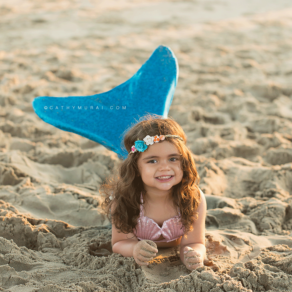 The Little Mermaid Themed Birthday Photography, 3 year old birthday girl wearing little mermaid costume laying on the sand on the beach showing her turquoise color tail during her birthday photo session, Disney inspired, the little mermaid, beach session, Manhattan Beach, Disney’s little mermaid, Mermaid Photography Prop, toddler mermaid photography, disney inspired photography, little mermaid inspired birthday photography, little mermaid inspired birthday photos, little mermaid inspired birthday pictures, little mermaid inspired birthday portraits, mermaid tail, Every little girl dreams of being a Mermaid, little mermaid beach session, turquoise mermaid tail, LOS ANGELES Birthday Portraits, LOS ANGELES Birthday pictures, LOS ANGELES Birthday Photographer, LOS ANGELES Birthday Photography, LOS ANGELES Toddler Photographer, LOS ANGELES Toddler Photography, LOS ANGELES Child Photography, LA Birthday Portraits, LA Birthday pictures, LA Birthday Photographer, LA Birthday Photography, LA Toddler Photographer, LA Toddler Photography, LA Child Photography, SAN GABRIEL Birthday Portraits, SAN GABRIEL Birthday pictures, SAN GABRIEL Birthday Photographer, SAN GABRIEL Birthday Photography, SAN GABRIEL Toddler Photographer, SAN GABRIEL Toddler Photography, ALHAMBRA Birthday Portraits, ALHAMBRA Birthday pictures, ALHAMBRA Birthday Photographer, ALHAMBRA Birthday Photography, ALHAMBRA Toddler Photographer, ALHAMBRA Toddler Photography, SAN MARINO Birthday Portraits, SAN MARINO Birthday pictures, SAN MARINO Birthday Photographer, SAN MARINO Birthday Photography, SAN MARINO Toddler Photographer, SAN MARINO Toddler Photography, SOUTH PASADENA Birthday Portraits, SOUTH PASADENA Birthday pictures, SOUTH PASADENA Birthday Photographer, SOUTH PASADENA Birthday Photography, SOUTH PASADENA Toddler Photographer, SOUTH PASADENA Toddler Photography, PASADENA Birthday Portraits, PASADENA Birthday pictures, PASADENA Birthday Photographer, PASADENA Birthday Photography, PASADENA Toddler Photographer, PASADENA Toddler Photography, DOWNTOWN LA Birthday Portraits, DOWNTOWN LA Birthday pictures, DOWNTOWN LA Birthday Photographer, DOWNTOWN LA Birthday Photography, DOWNTOWN LA Toddler Photographer, DOWNTOWN LA Toddler Photography, GLENDALE Birthday Portraits, GLENDALE Birthday pictures, GLENDALE Birthday Photographer, GLENDALE Birthday Photography, GLENDALE Toddler Photographer, GLENDALE Toddler Photography, Birthday portraits, birthday pictures, birthday photographer, birthday photography, toddler photographer, toddler photography,