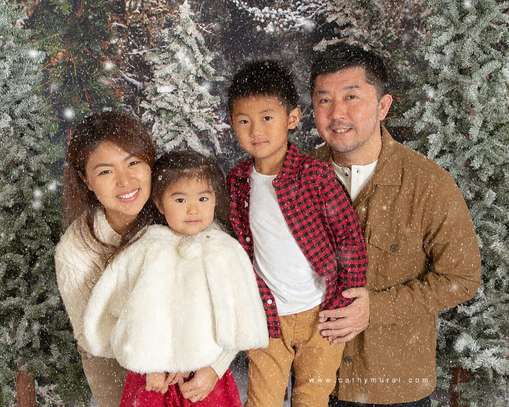 Holiday mini photo sessions near me Cathy Murai Photography created  this family portrait using a snow machine and photoshop during holiday mini sessions in Irvine, CA. 2020 Orange County Christmas mini photo session.